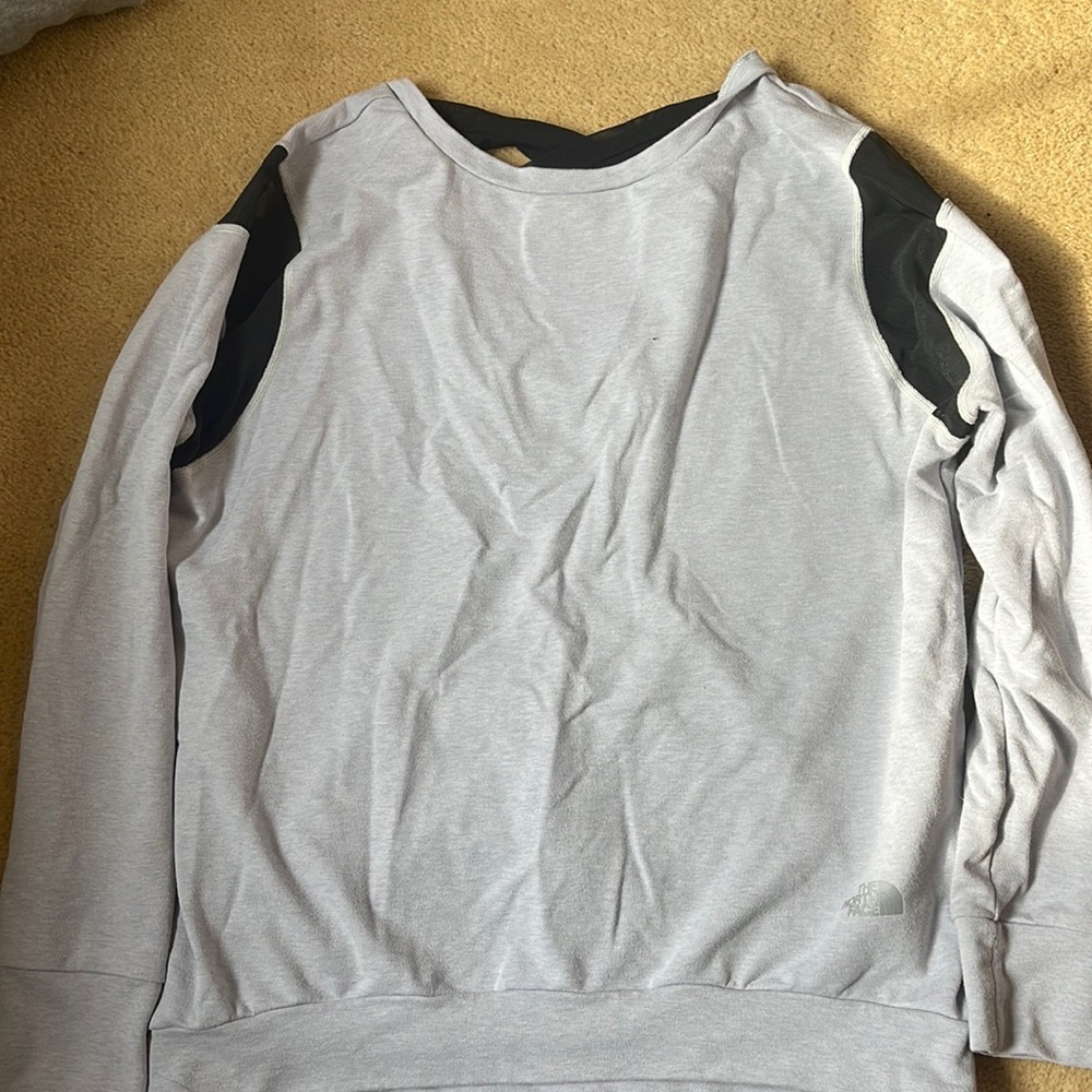 Gray North Face women’s sweatshirt with open back and black detail